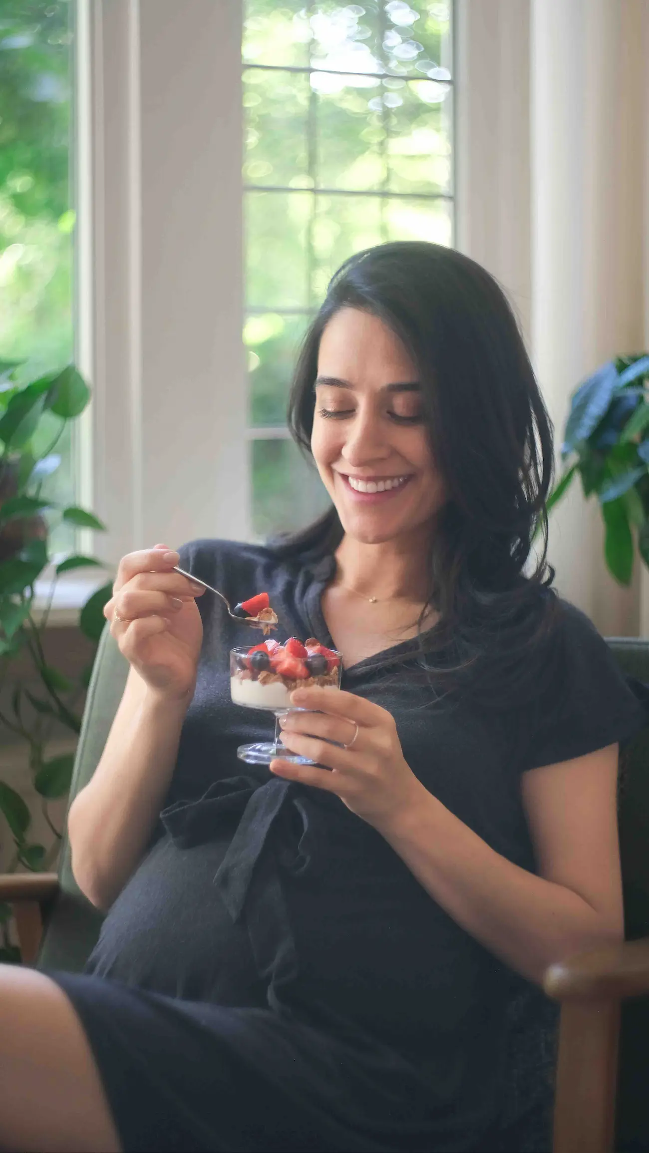 Vegan pregnancy what I eat in a day — plant-based parfait with fruit and granola for a healthy pregnancy snack idea.